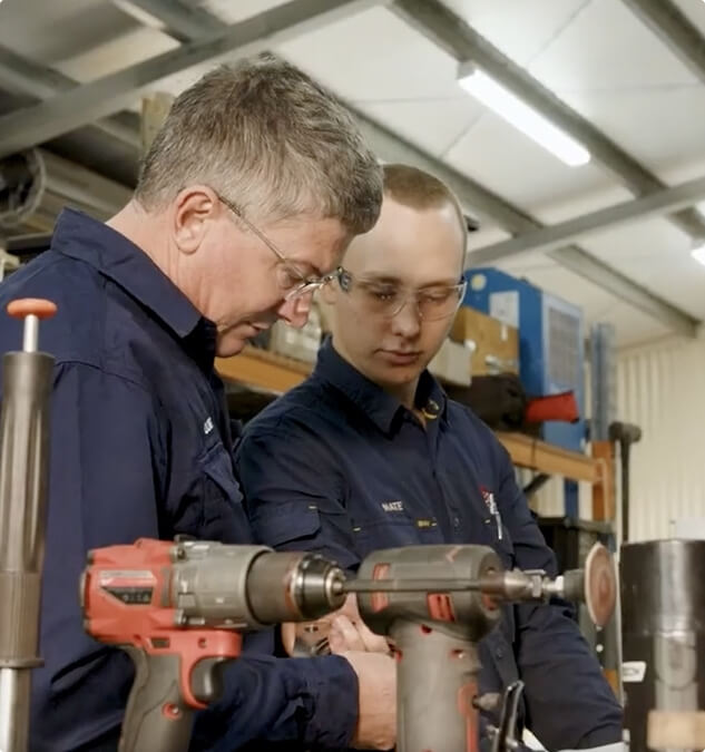 KCL Industries technicians collaborating in workshop to assemble and maintain mining equipment